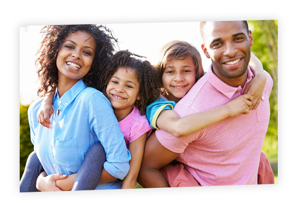 A family of four posing for the camera.